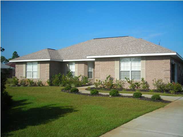 437 Shipwreck Road Santa Rosa Beach, FL 32459 - Photo 1 of 6 a front view of a house with a garden and plants