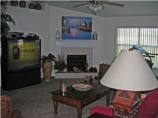 437 Shipwreck Road Santa Rosa Beach, FL 32459 - Photo 4 of 6 a living room with furniture and a fireplace