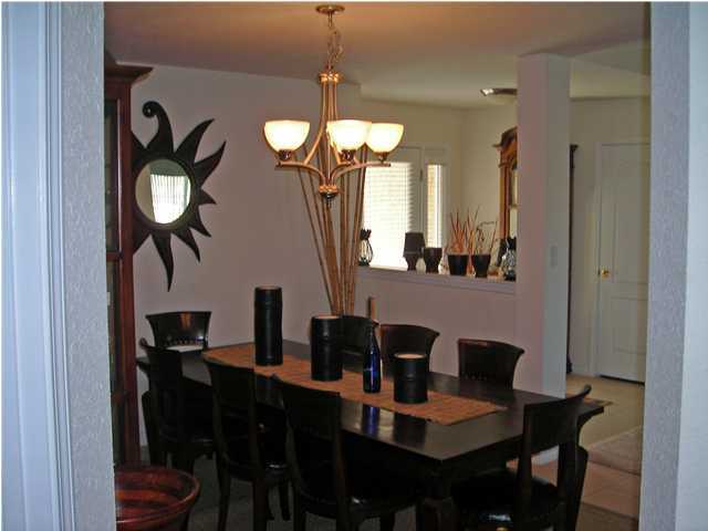 437 Shipwreck Road Santa Rosa Beach, FL 32459 - Photo 5 of 6 a view of a dining room with furniture and chandelier