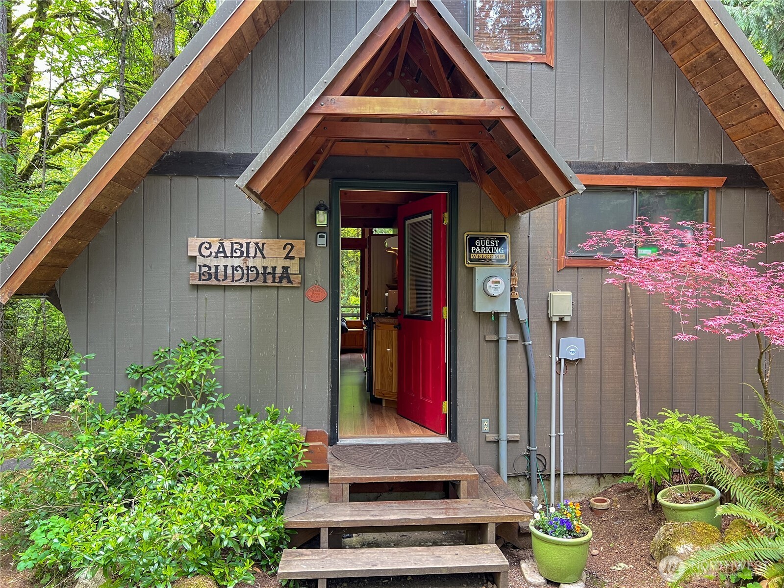 423 Lords Lake Loop Road Quilcene, WA 98376 - Photo 17 of 40 a front view of house with yard