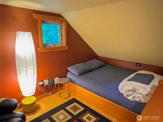 a bedroom with a bed and furniture