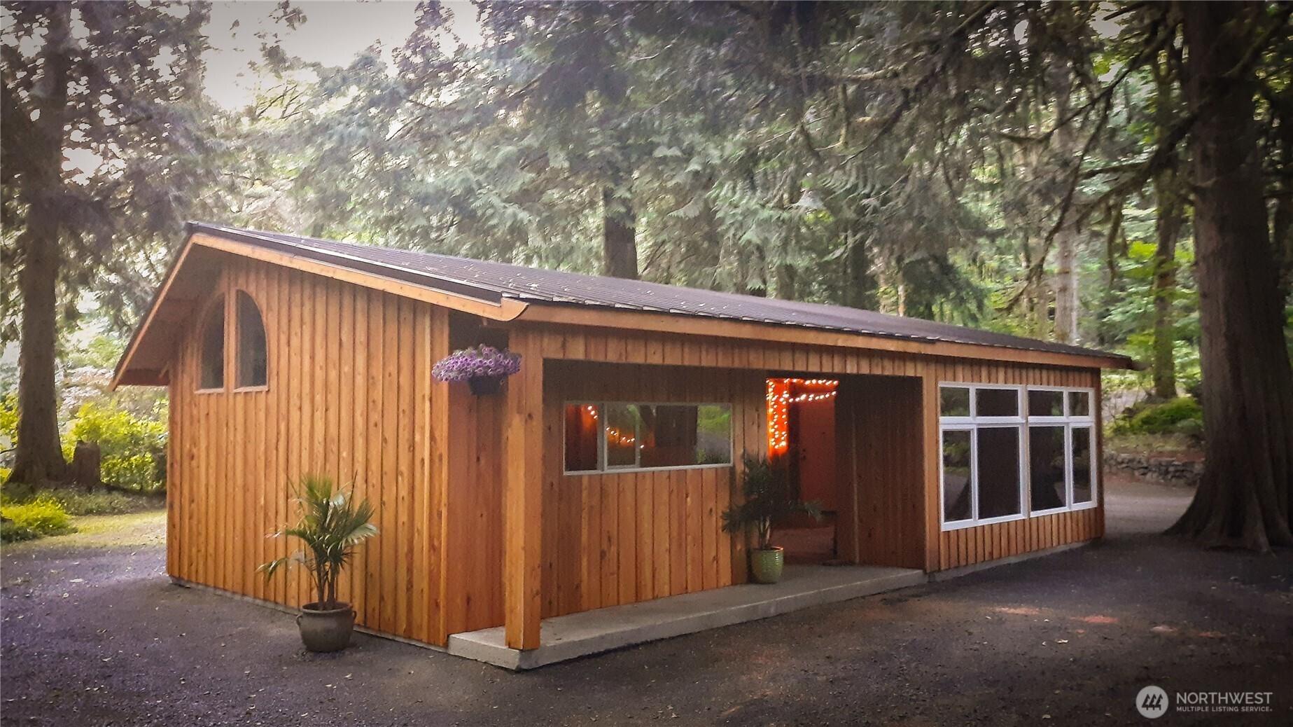 423 Lords Lake Loop Road Quilcene, WA 98376 - Photo 3 of 40 a view of a house with a large tree