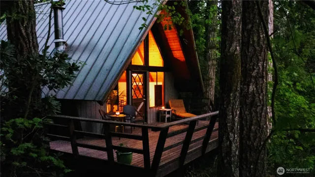 a view of a house with a large tree