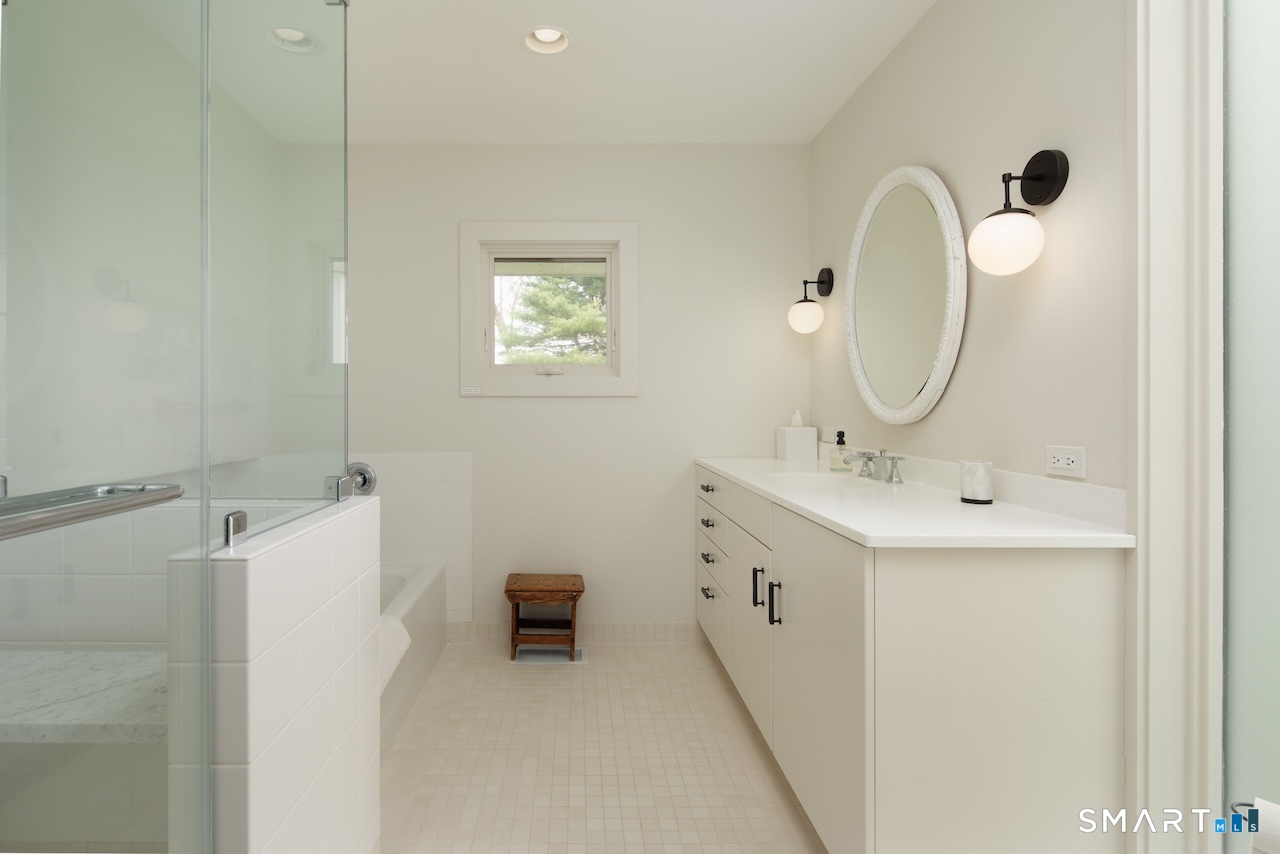 165 Interlaken Road Salisbury, CT 06039 - Photo 18 of 31 a bathroom with a double vanity sink mirror and tub