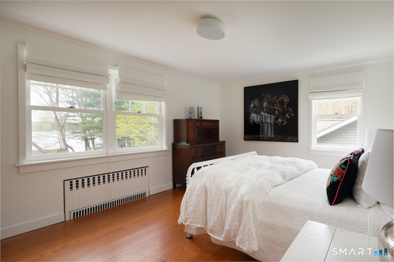 165 Interlaken Road Salisbury, CT 06039 - Photo 23 of 31 a bedroom with a bed and a window with chair