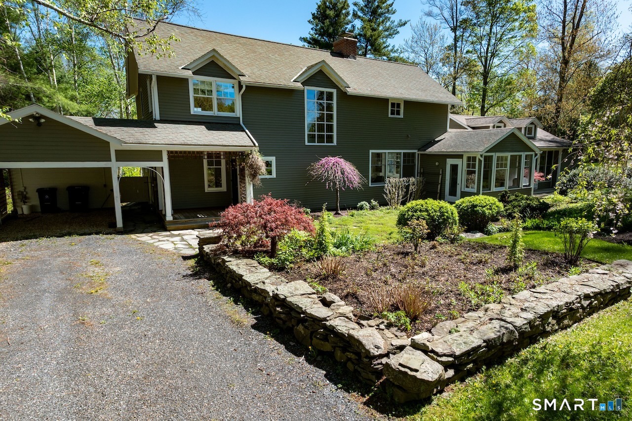 165 Interlaken Road Salisbury, CT 06039 - Photo 26 of 31 a front view of a house with a yard and garage