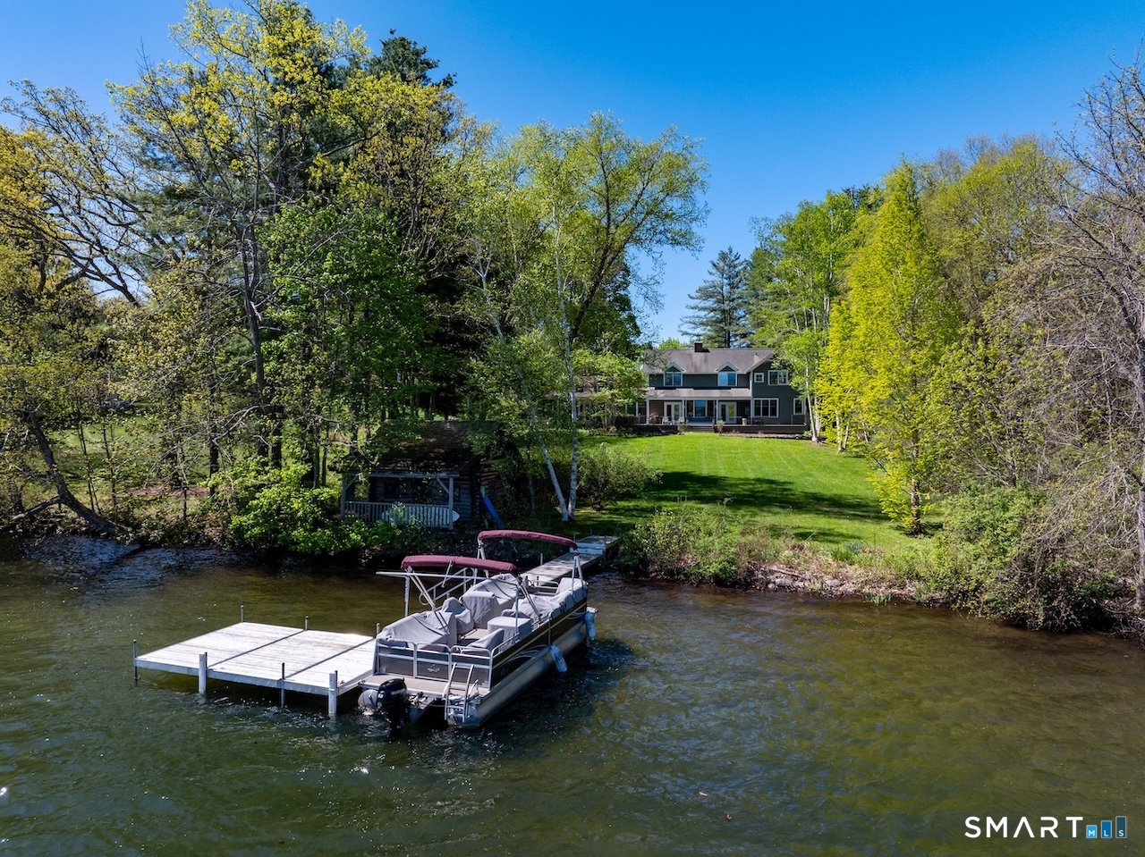 165 Interlaken Road Salisbury, CT 06039 - Photo 30 of 31 a lake view with boat and trees in the background