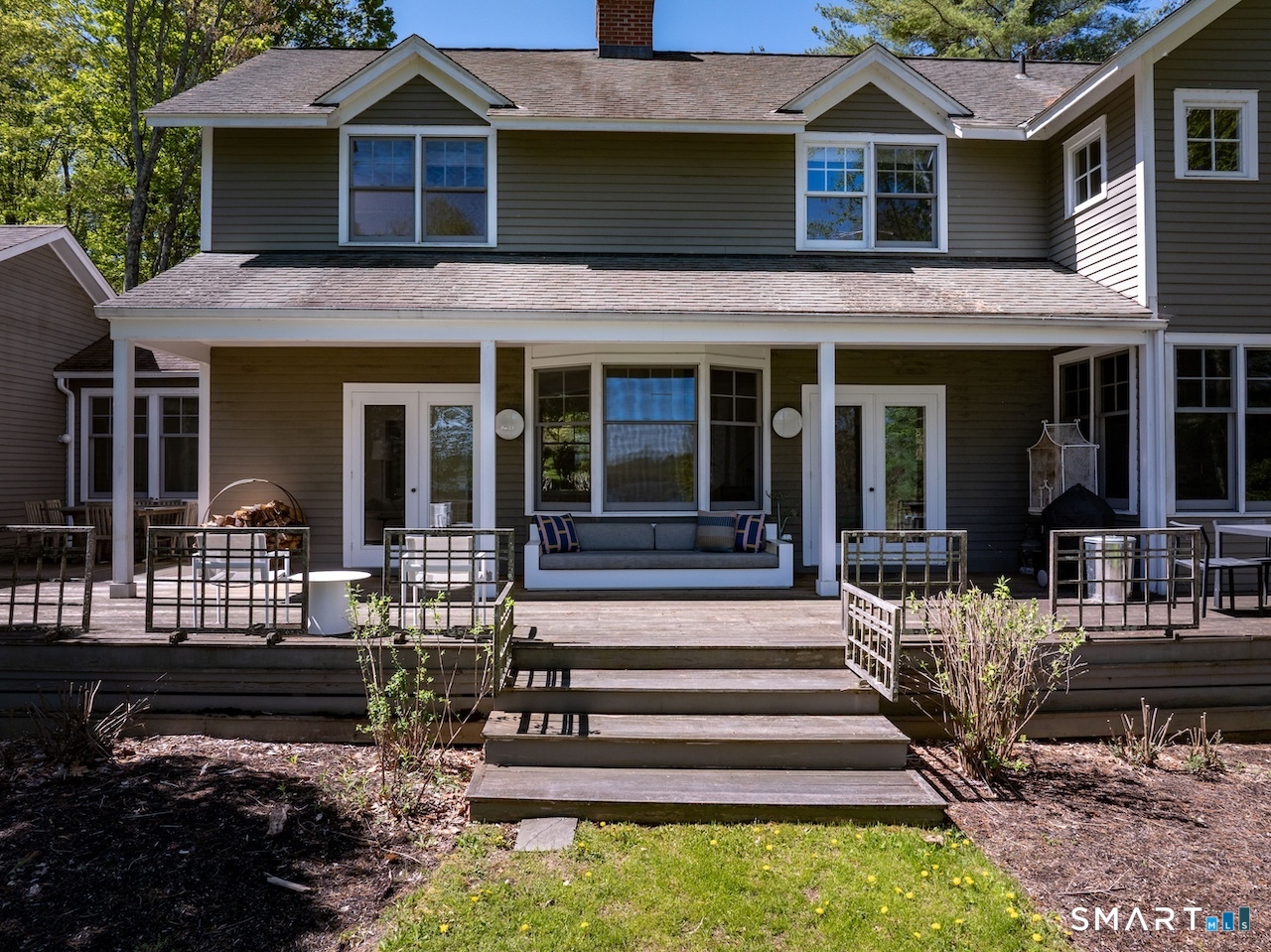 165 Interlaken Road Salisbury, CT 06039 - Photo 4 of 31 a front view of a house with porch and outdoor seating