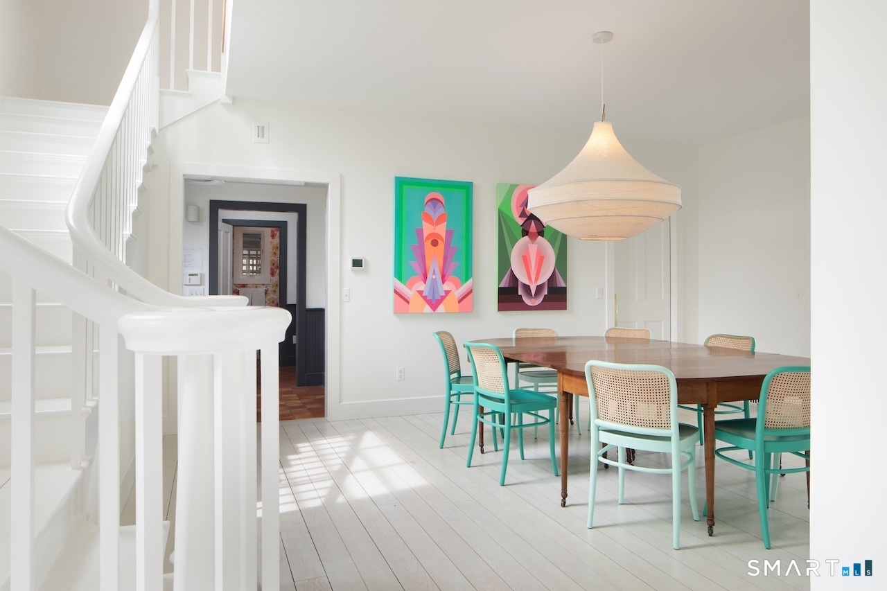 165 Interlaken Road Salisbury, CT 06039 - Photo 7 of 31 a view of a dining room with furniture wooden floor and a chandelier