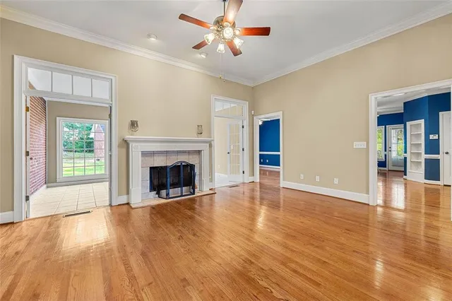 a view of a livingroom with a fireplace and window