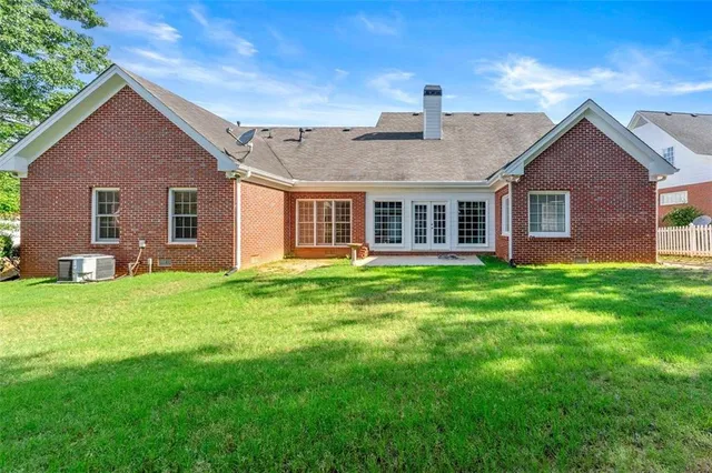 a front view of house with yard and green space