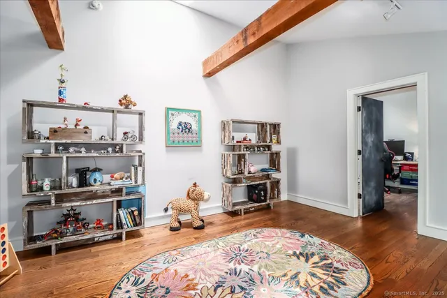 a bedroom with bed and a window