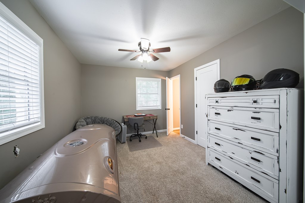 6315 Rockefeller Drive Columbus, GA 31909 - Photo 16 of 24 a bedroom with a bed and a dresser