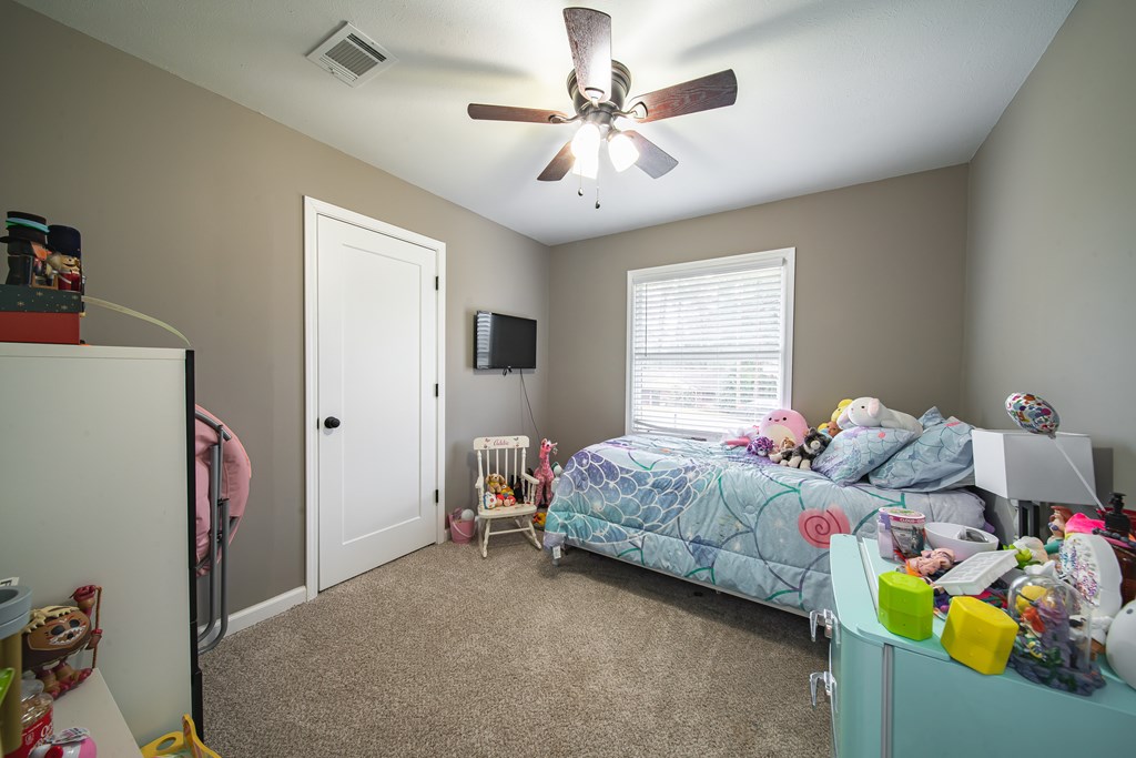6315 Rockefeller Drive Columbus, GA 31909 - Photo 18 of 24 a bedroom with bed and windows