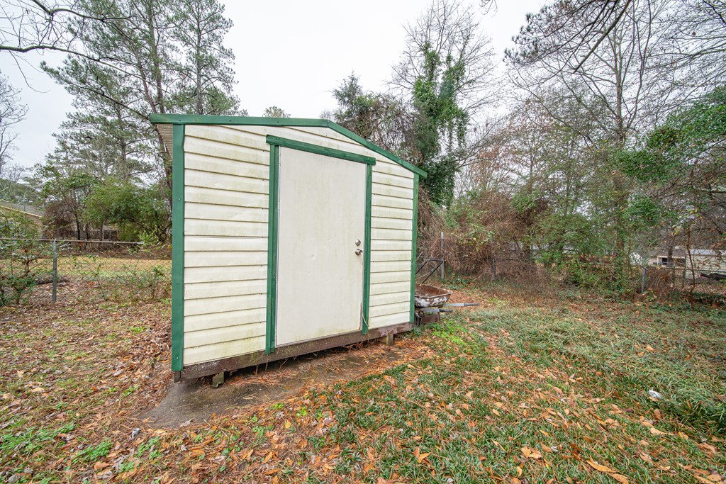 6315 Rockefeller Drive Columbus, GA 31909 - Photo 22 of 24 a view of a house with a yard