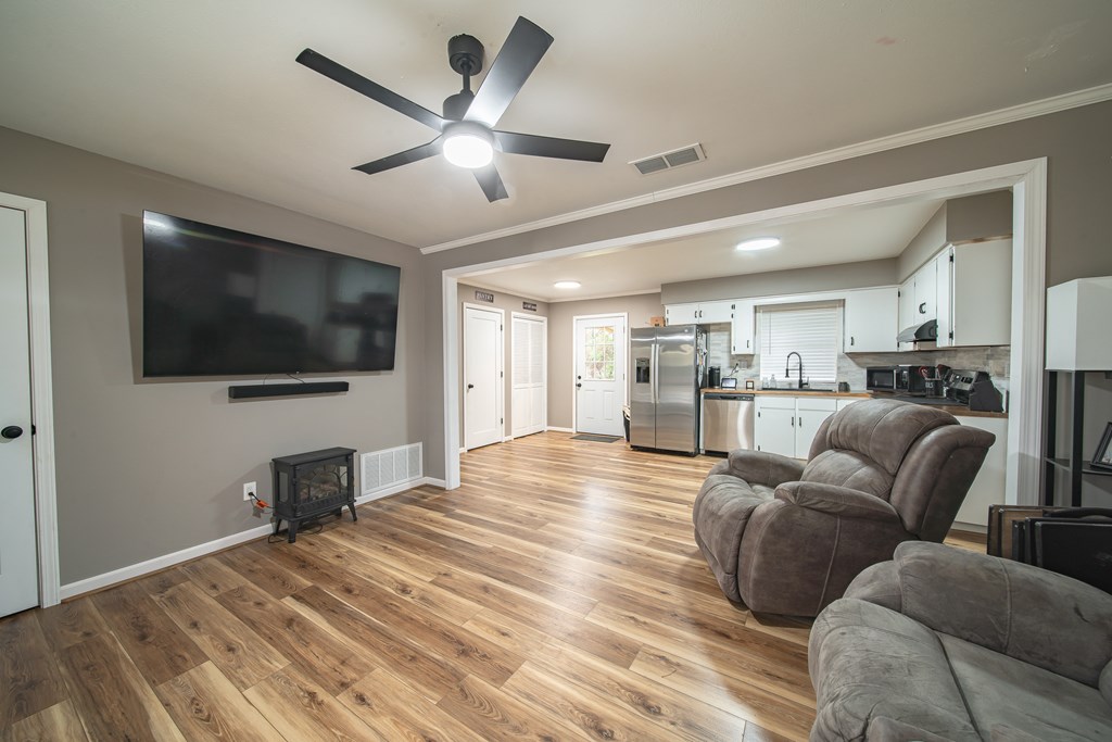 6315 Rockefeller Drive Columbus, GA 31909 - Photo 4 of 24 a living room with furniture and a flat screen tv