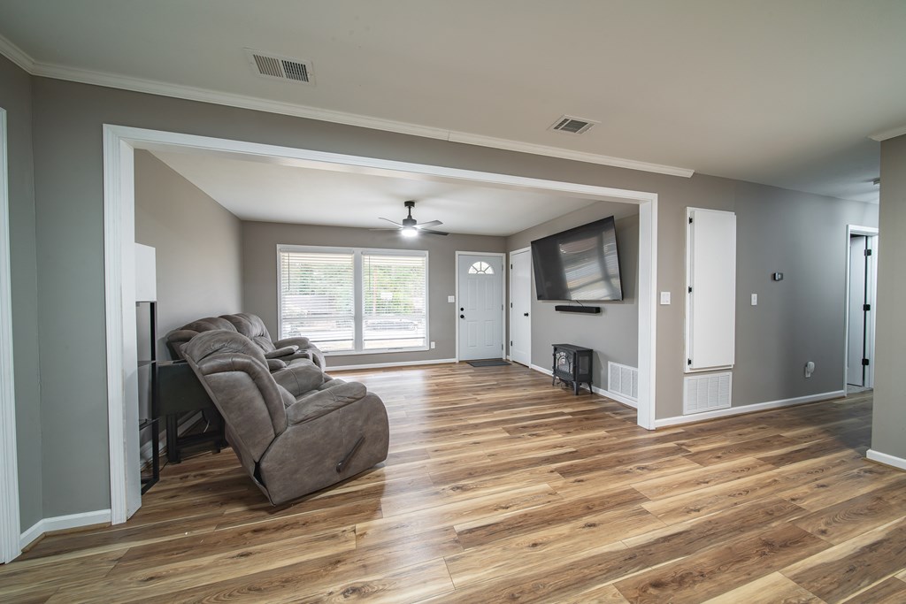 6315 Rockefeller Drive Columbus, GA 31909 - Photo 10 of 24 a spacious bedroom with a bed and a couch