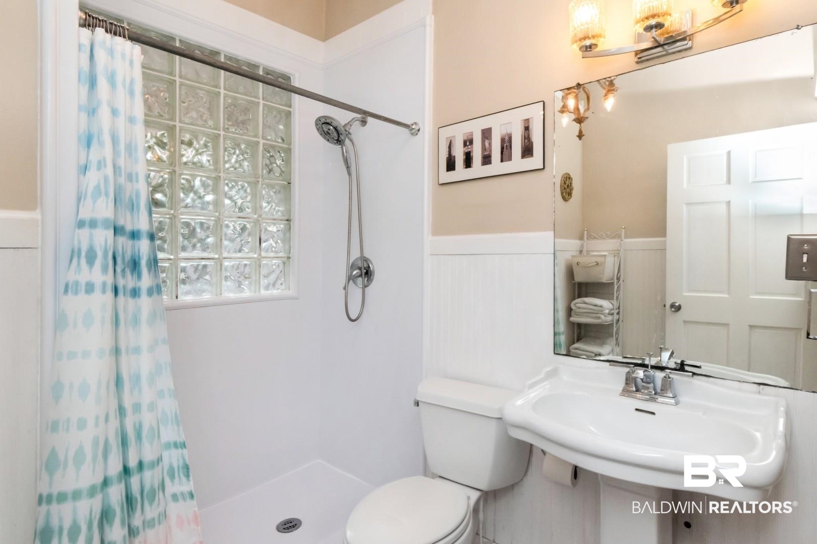 135 Silverwood Street Mobile, AL 36607 - Photo 12 of 32 Bathroom with a wainscoted wall and a shower stall