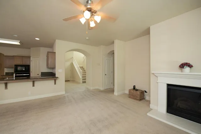 a view of a livingroom with furniture and a fireplace