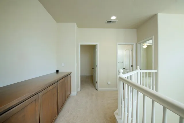 a view of a hallway with windows