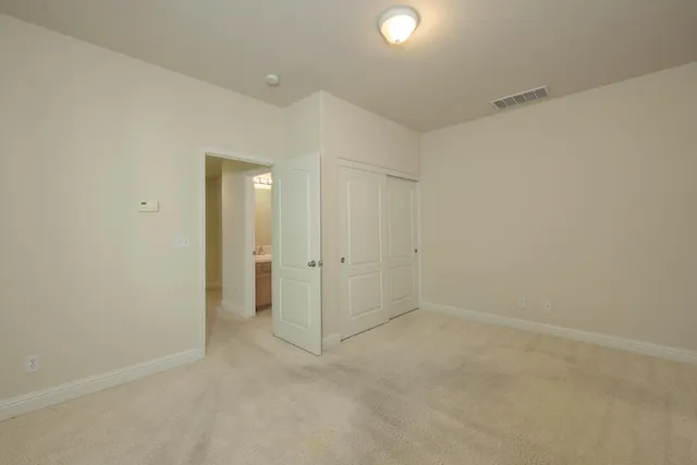 a bathroom with a sink and mirror with toilet