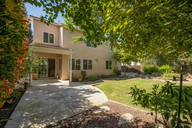 a house view with a garden space