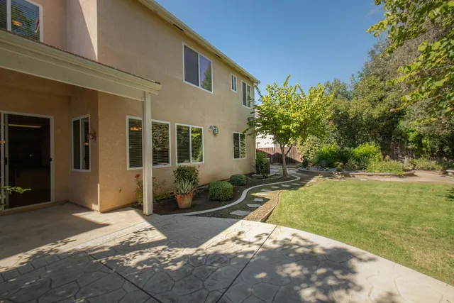 a house view with a backyard space