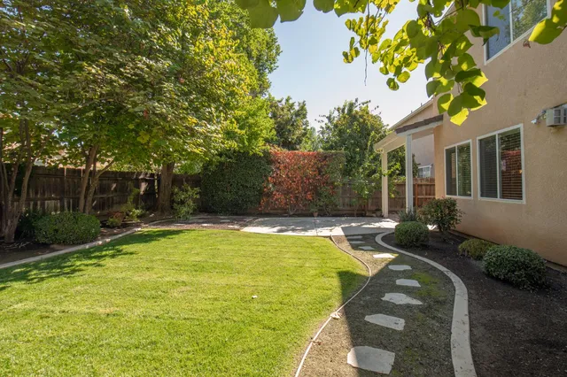 a view of backyard with green space