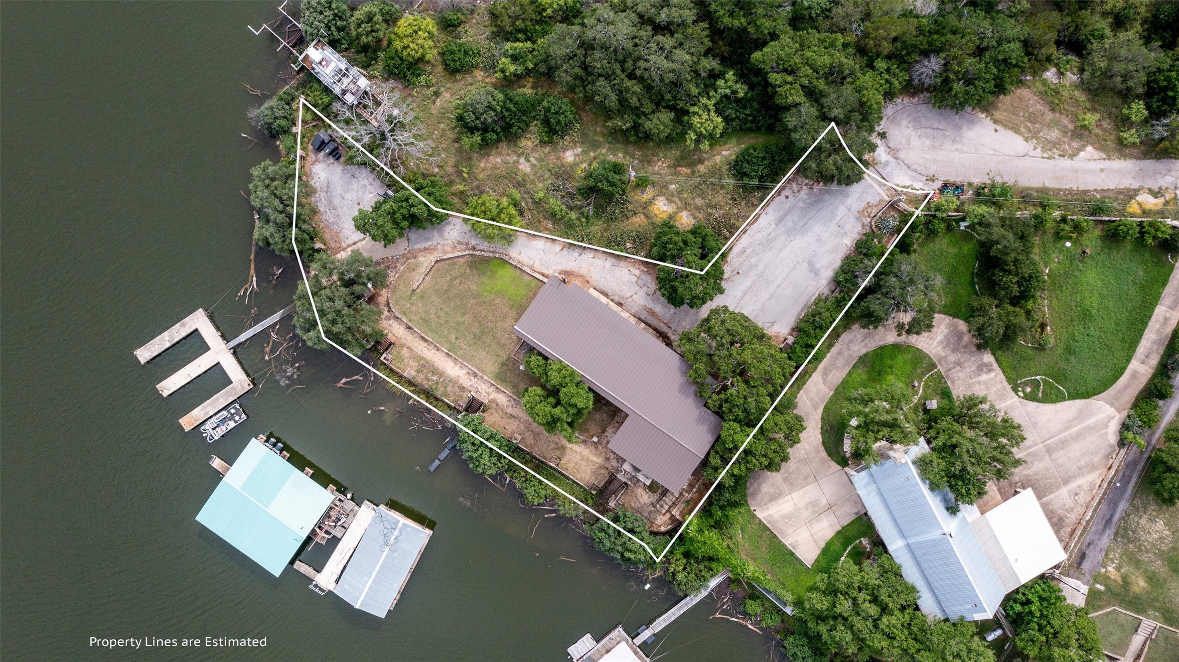 325 Eagle Rest Burnet, TX 78611 - Photo 3 of 40 Aerial view showcasing a waterfront property with a private boat dock and lush surroundings.