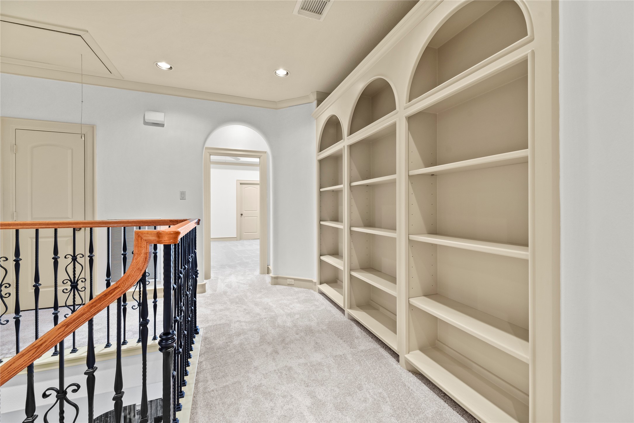 16610 Champagne Falls Court Spring, TX 77379 - Photo 33 of 45 a view of a hallway with wooden floor and windows