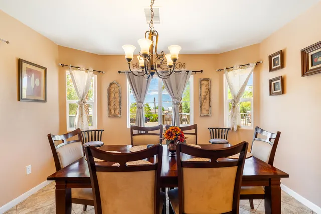 a view of a dining room with furniture and windows