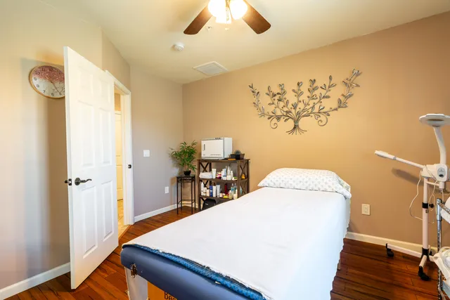 a room with a table and a chandelier