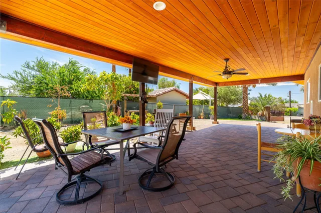 a view of a swimming pool and lounge chairs
