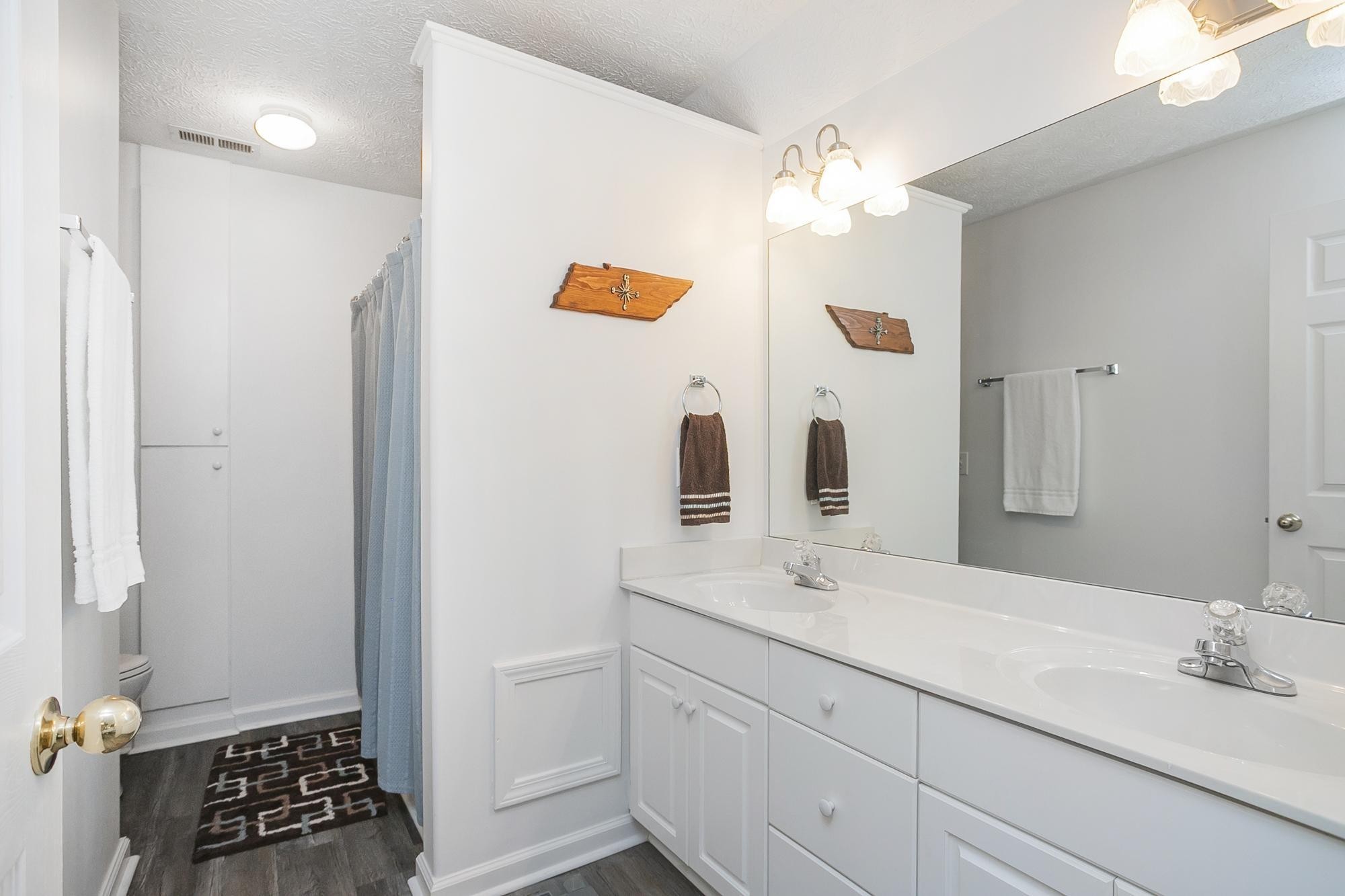 3911 Dodson Chapel Road, Unit 32 Hermitage, TN 37076 - Photo 15 of 25 a bathroom with a sink and a mirror