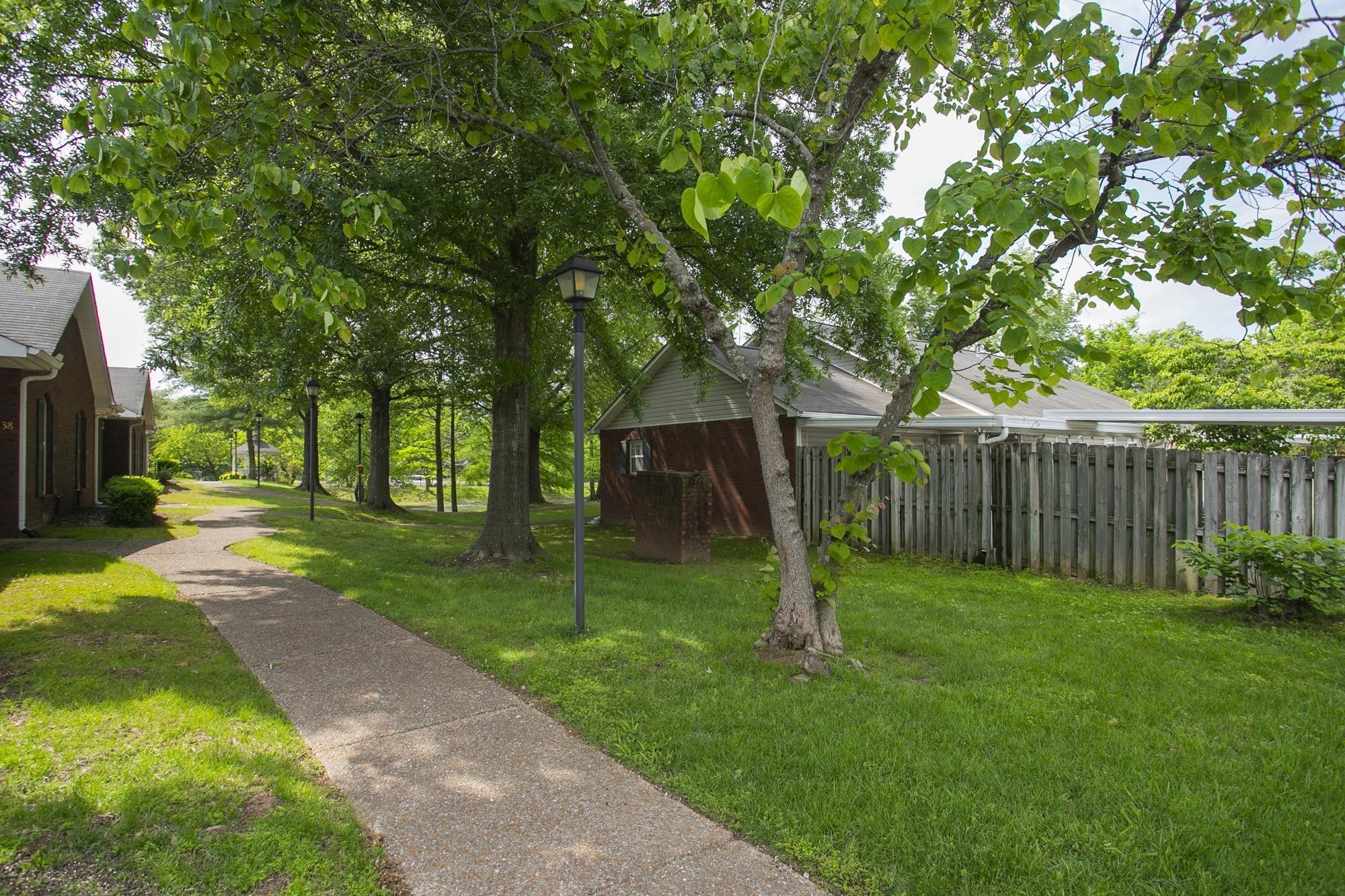 3911 Dodson Chapel Road, Unit 32 Hermitage, TN 37076 - Photo 23 of 25 a view of a backyard with tree s