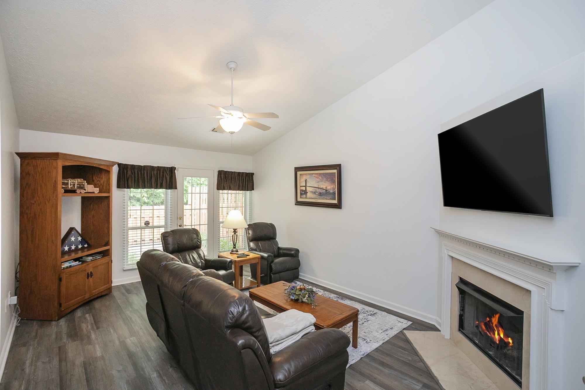3911 Dodson Chapel Road, Unit 32 Hermitage, TN 37076 - Photo 3 of 25 a living room with furniture and a flat screen tv
