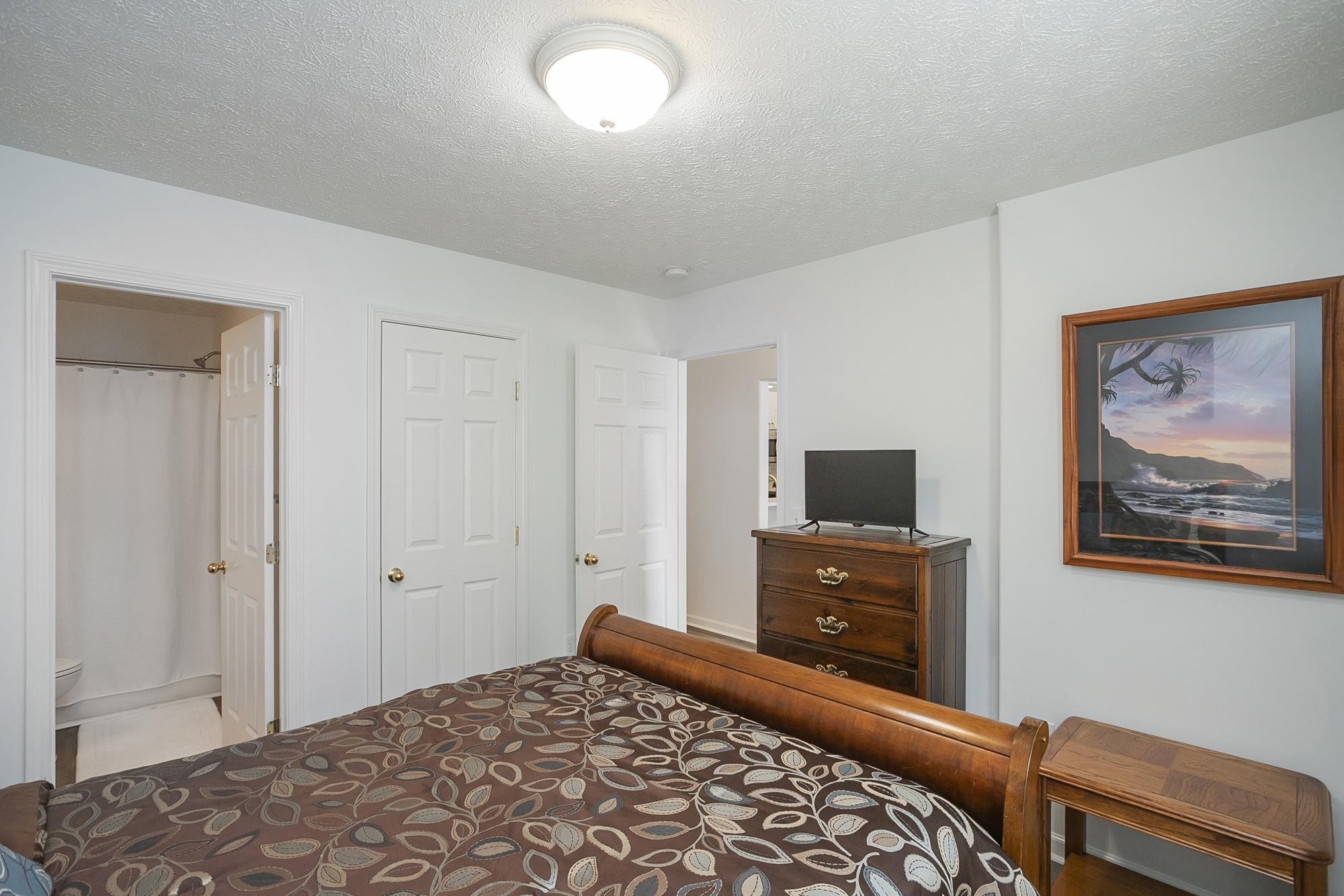 3911 Dodson Chapel Road, Unit 32 Hermitage, TN 37076 - Photo 10 of 25 a bedroom with a bed and a television