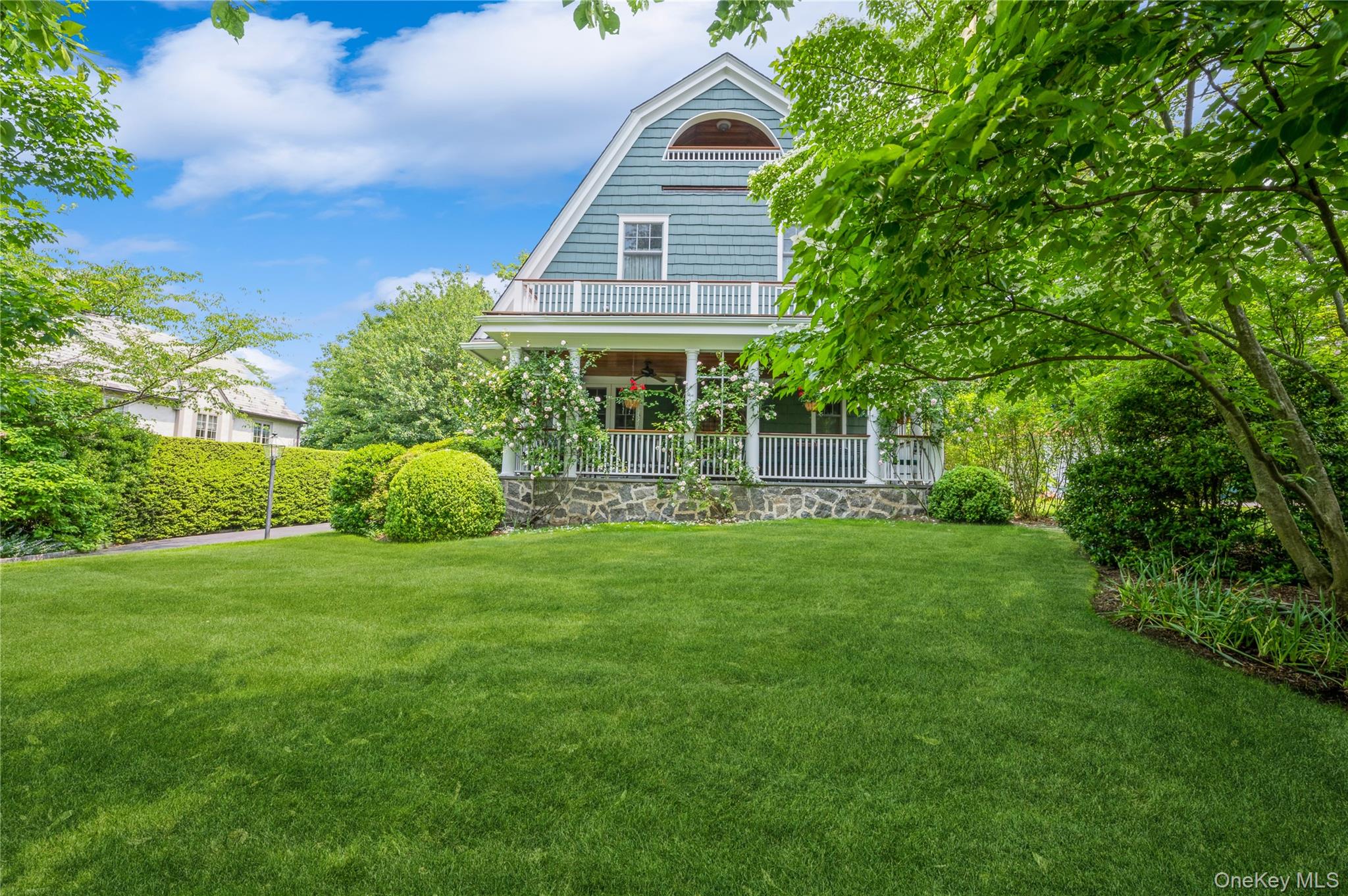 31 Emerson Road Larchmont, NY 10538 - Photo 32 of 39 The covered porch has mature roses and creates a cozy entertaining space. Want to use it year round? Get a fire table and enjoy!