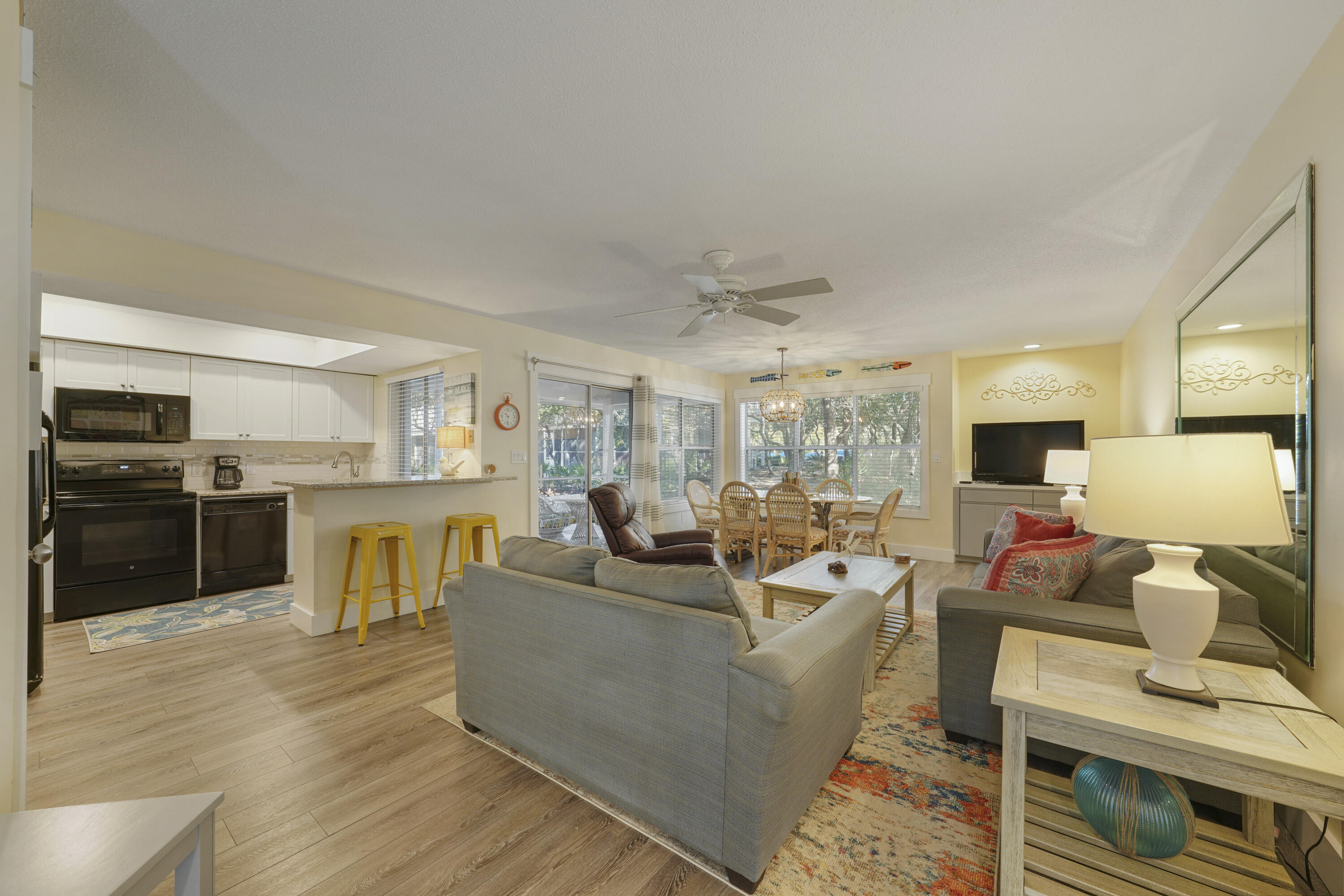 9815 Highway 98, Unit 200 Miramar Beach, FL 32550 - Photo 1 of 54 a living room with fireplace furniture and a wooden floor