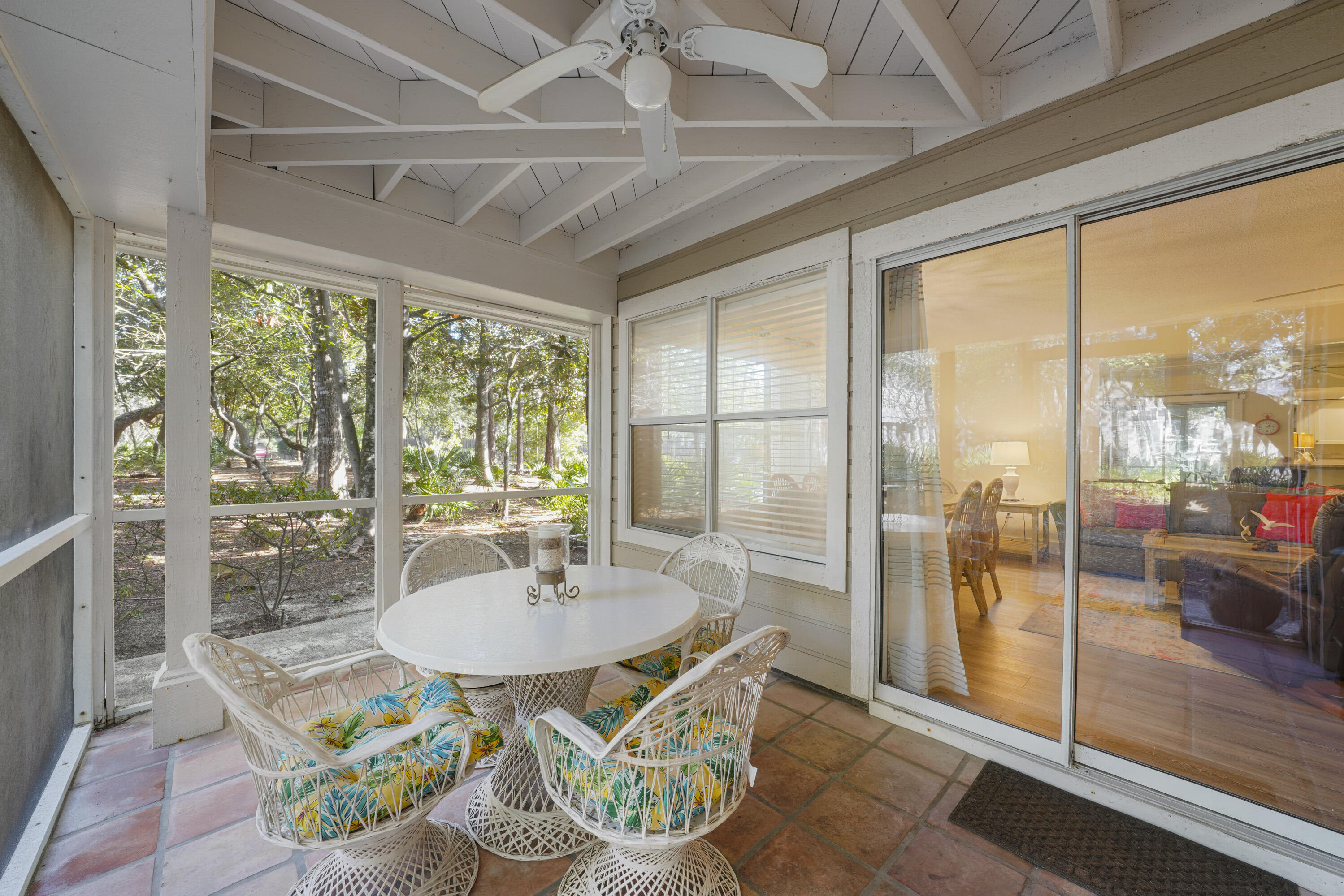 9815 Highway 98, Unit 200 Miramar Beach, FL 32550 - Photo 12 of 54 a dining room with wooden floor and a table