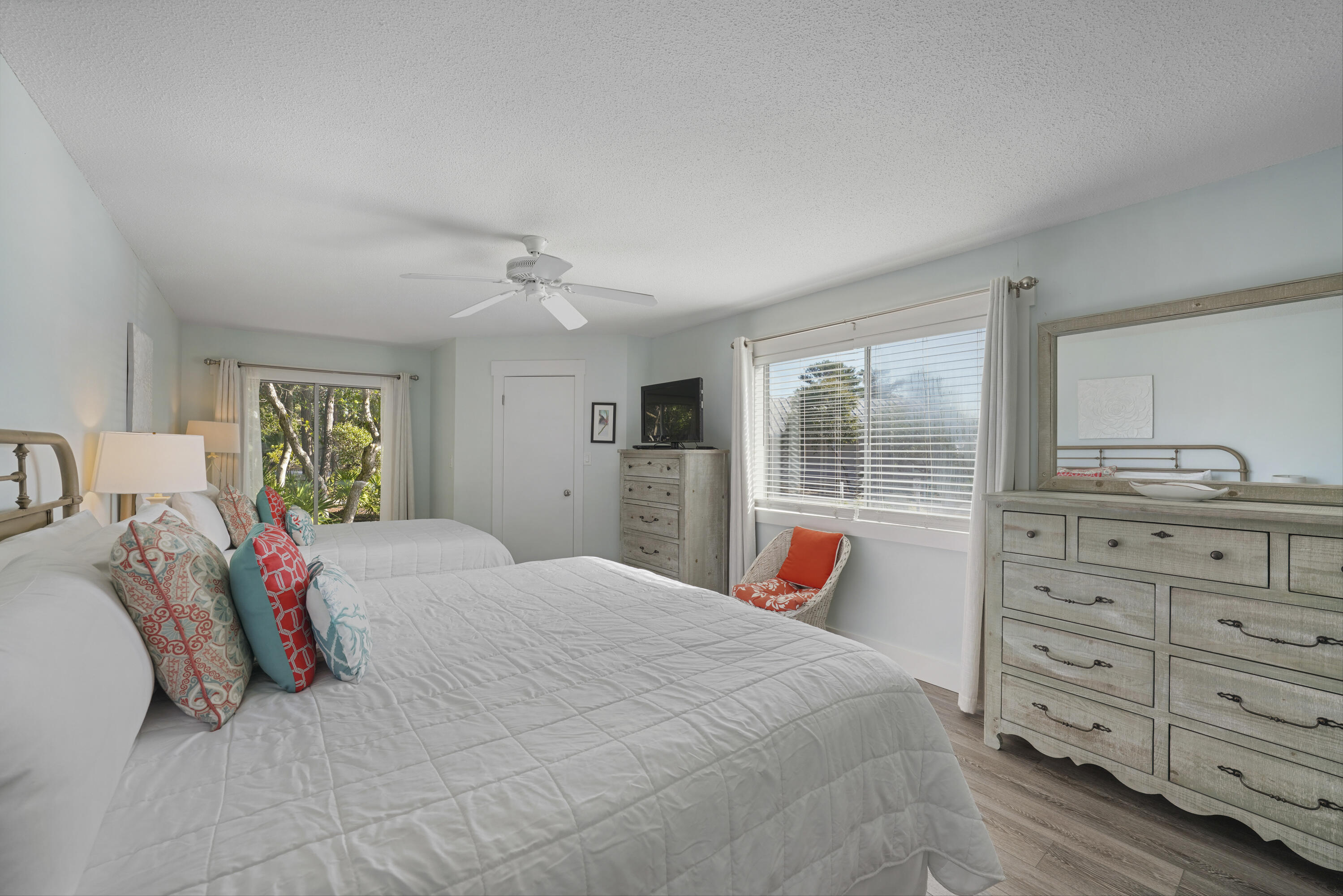 9815 Highway 98, Unit 200 Miramar Beach, FL 32550 - Photo 13 of 54 a bedroom with a bed and wooden floor