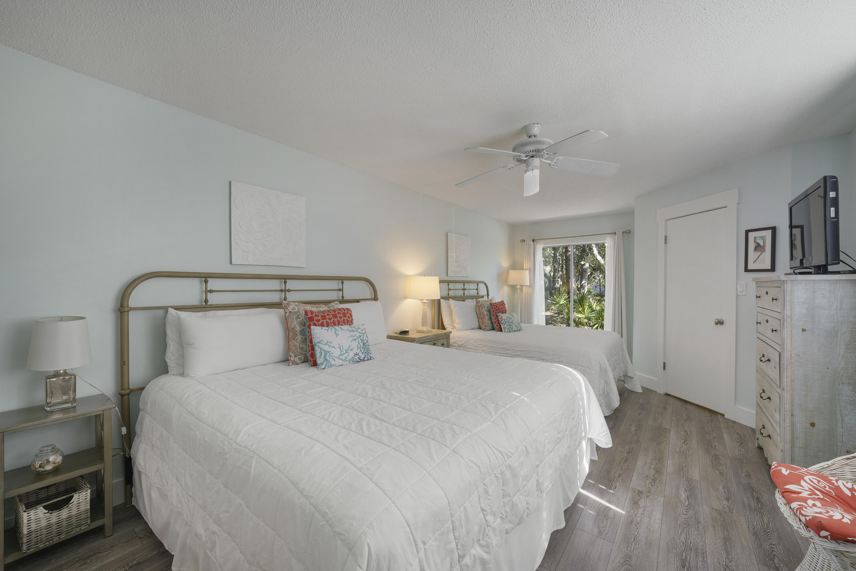 9815 Highway 98, Unit 200 Miramar Beach, FL 32550 - Photo 14 of 54 a bedroom with a bed and a chandelier