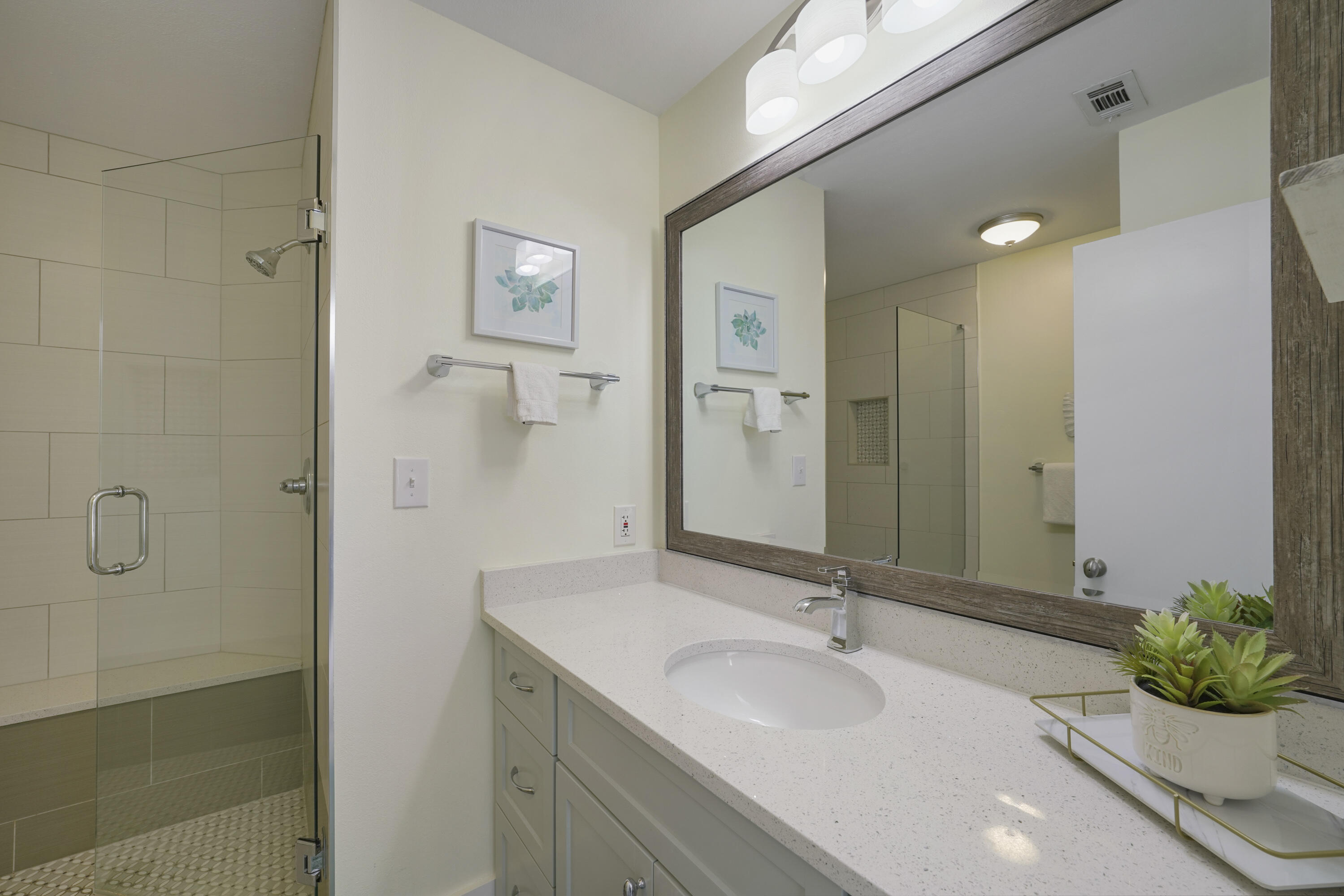 9815 Highway 98, Unit 200 Miramar Beach, FL 32550 - Photo 16 of 54 a bathroom with a sink and a mirror