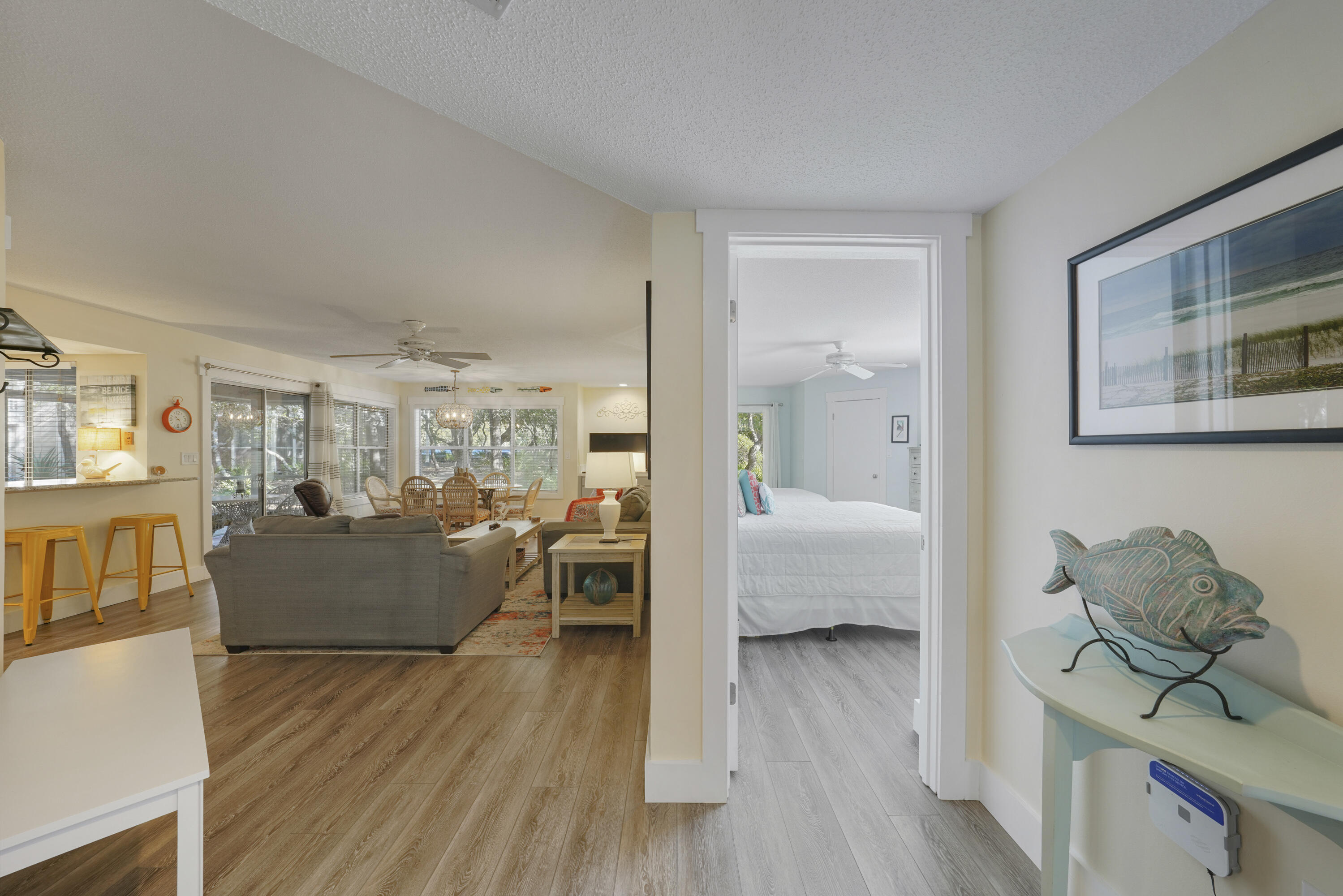 9815 Highway 98, Unit 200 Miramar Beach, FL 32550 - Photo 17 of 54 a living room with furniture and a wooden floor
