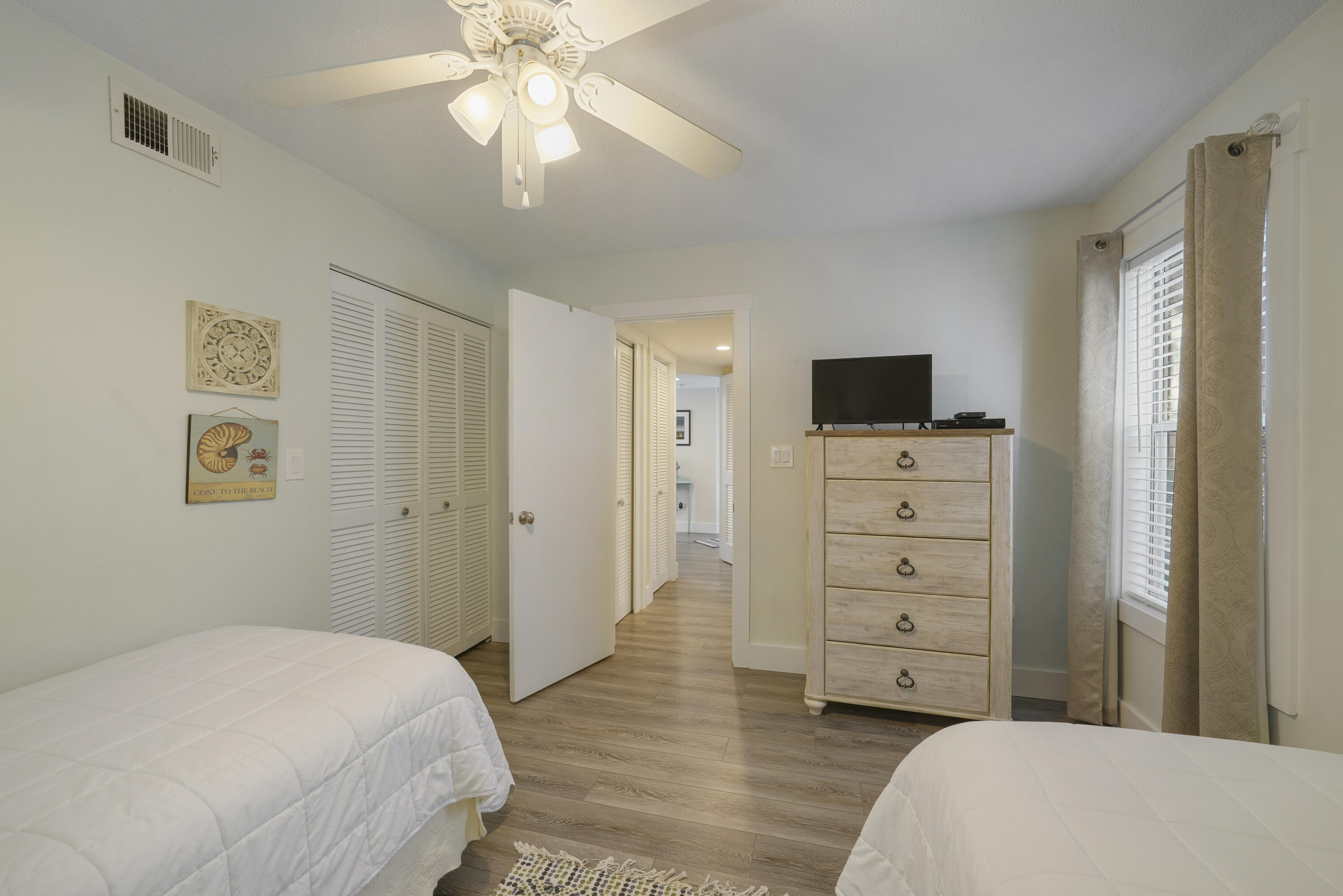 9815 Highway 98, Unit 200 Miramar Beach, FL 32550 - Photo 19 of 54 a bedroom with a bed and a television