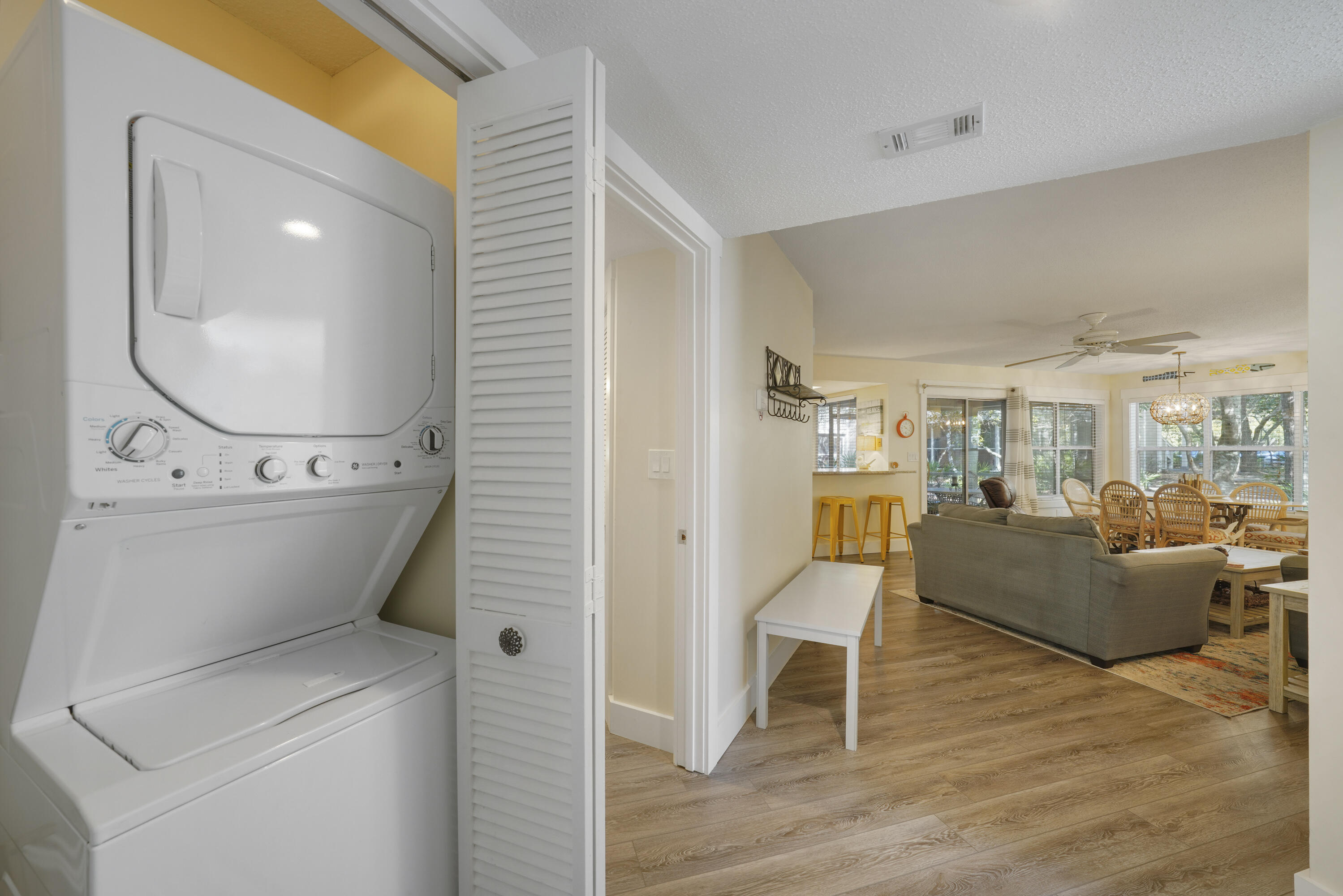 9815 Highway 98, Unit 200 Miramar Beach, FL 32550 - Photo 22 of 54 a living room with furniture and a wooden floor
