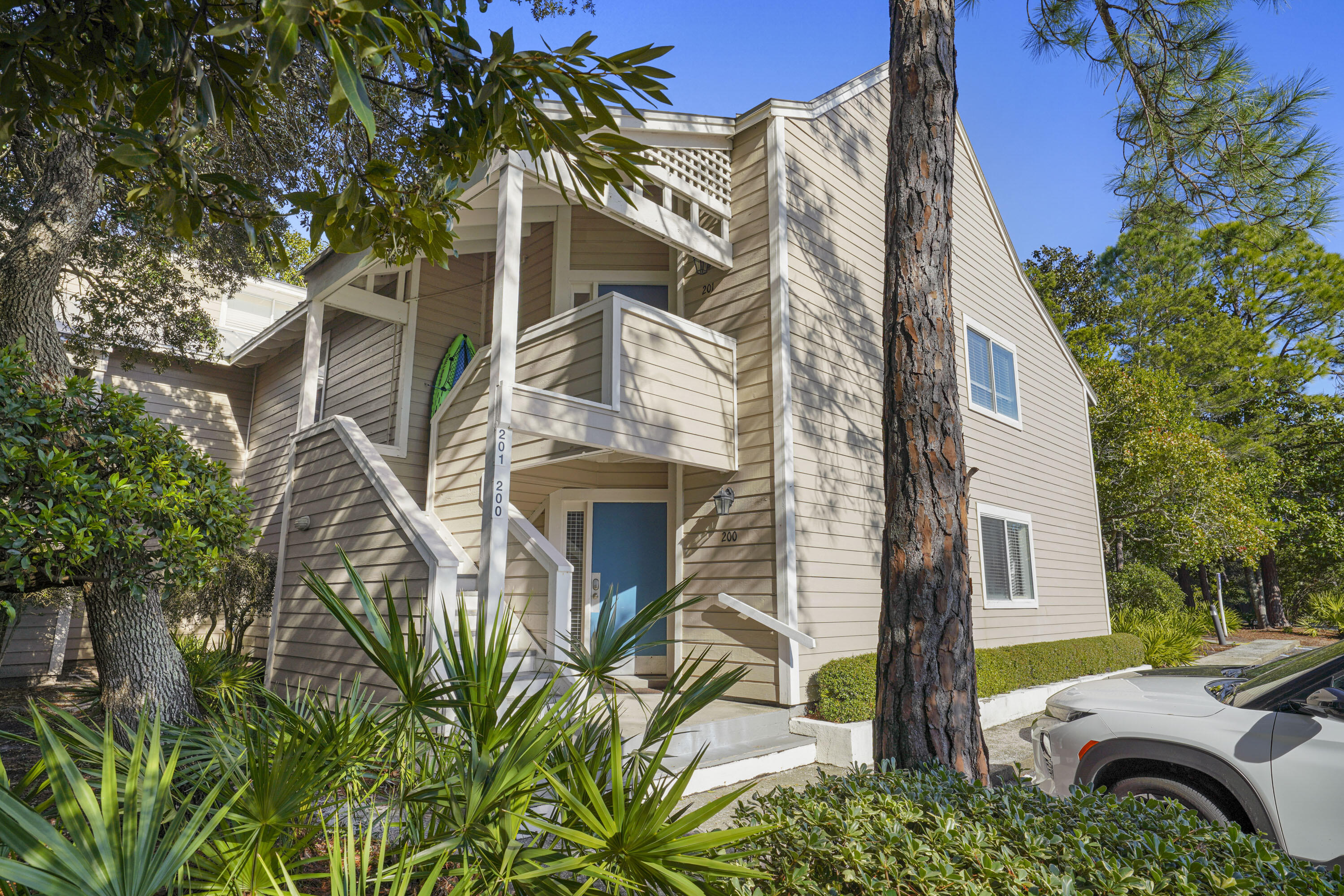 9815 Highway 98, Unit 200 Miramar Beach, FL 32550 - Photo 23 of 54 a front view of a house with garden
