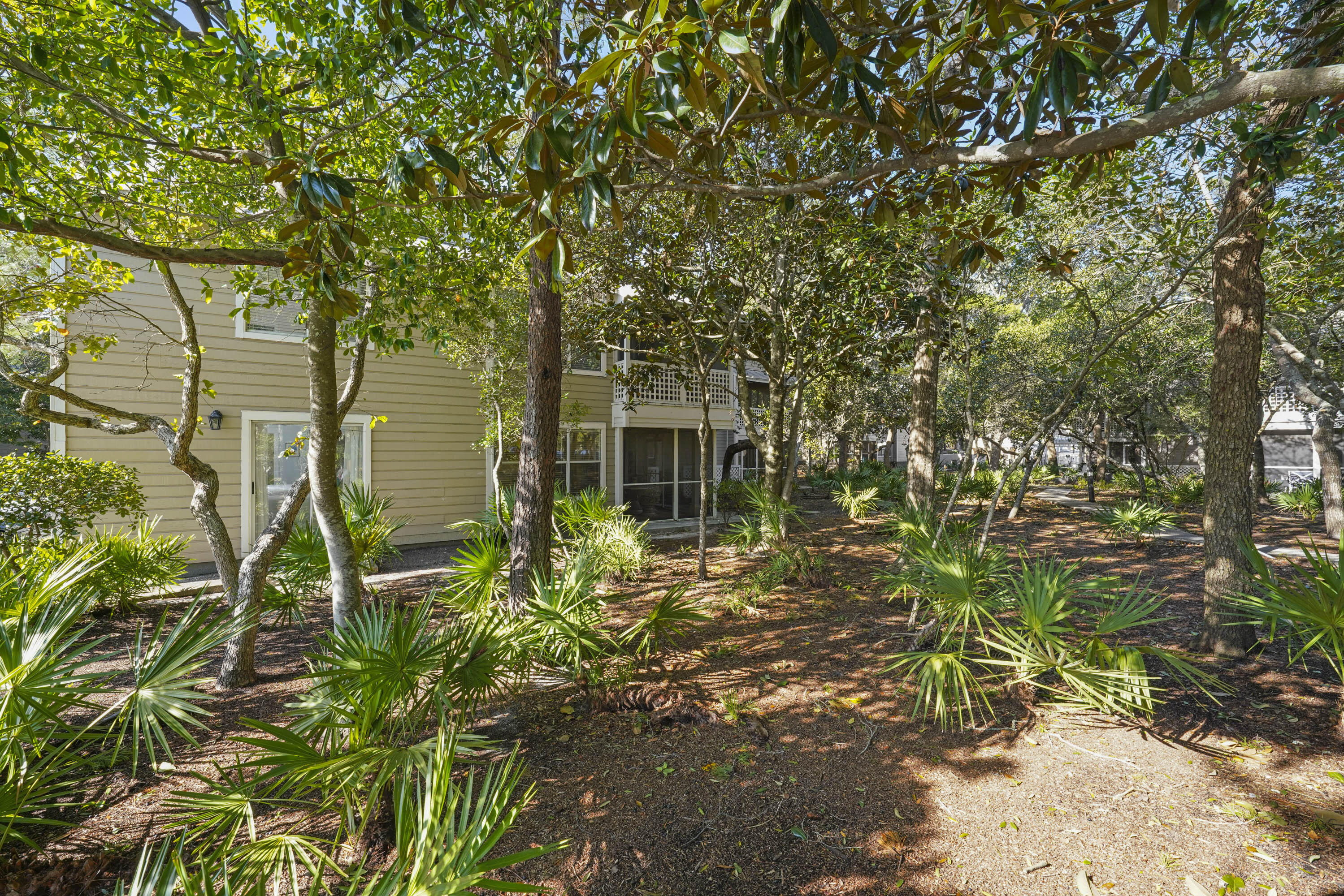 9815 Highway 98, Unit 200 Miramar Beach, FL 32550 - Photo 27 of 54 a backyard of a house with lots of green space