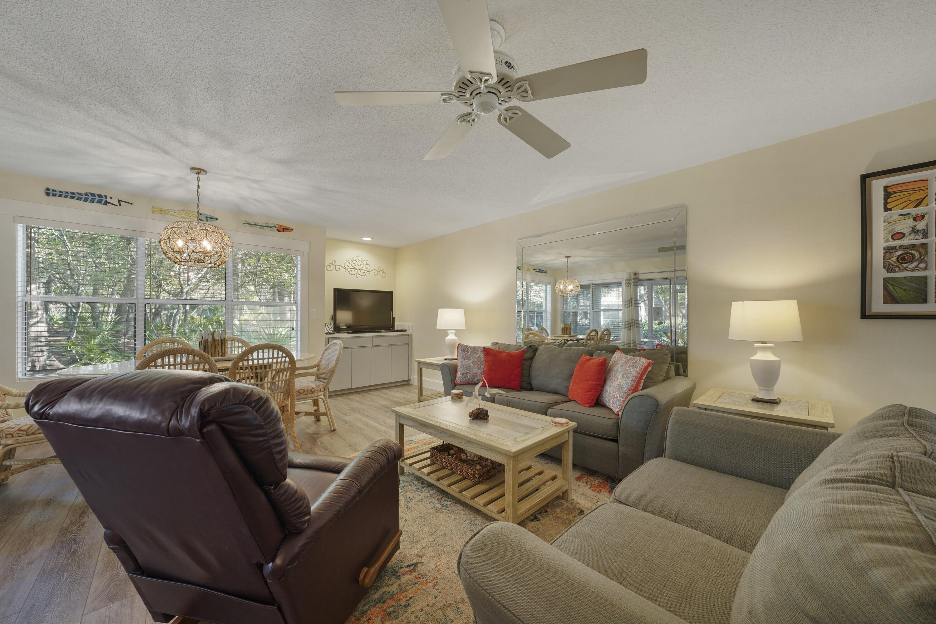 9815 Highway 98, Unit 200 Miramar Beach, FL 32550 - Photo 3 of 54 a living room with furniture ceiling fan and a window