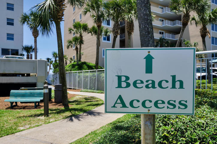 9815 Highway 98, Unit 200 Miramar Beach, FL 32550 - Photo 31 of 54 a street sign that is sitting on a brick wall